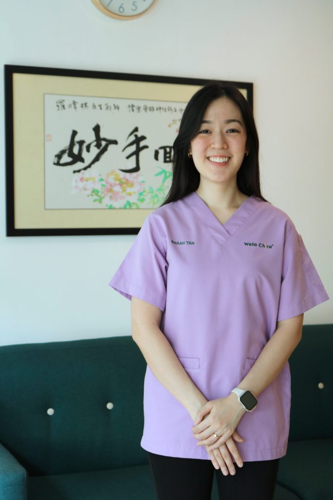 Portrait of Dr Sarah, wearing lavender scrubs