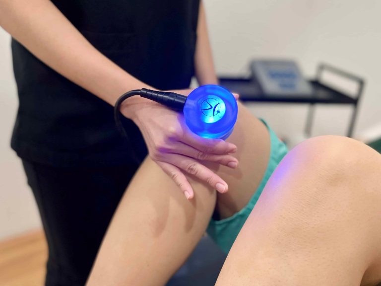 Therapeutic ultrasound being applied to a patient's knee